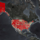 A map of the U.S. covered in red. The red areas are communities with median broadband speeds below the FFC's recommended benchmark.